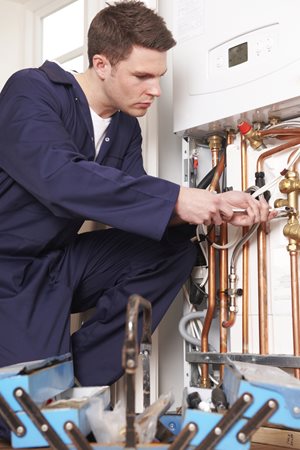 Gas Engineer fixing pipes